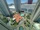 An overhead view of a building with a distinctive red roof, highlighting its architectural features and lush surroundings at 2777 Paradise Rd # 2701, Las Vegas, NV 89109