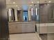Modern bathroom with double vanity, sleek mirrors, and a separate tub, showcasing luxury and comfort at 2777 Paradise Rd # 2701, Las Vegas, NV 89109