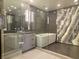 A modern bathroom with a glass-enclosed shower and soaking tub, featuring sleek fixtures and stylish design at 2777 Paradise Rd # 2701, Las Vegas, NV 89109