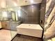 A modern bathroom with a soaking tub, featuring sleek fixtures and stylish design at 2777 Paradise Rd # 2701, Las Vegas, NV 89109