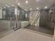A modern bathroom with a glass-enclosed shower and soaking tub, featuring sleek fixtures and stylish design at 2777 Paradise Rd # 2701, Las Vegas, NV 89109