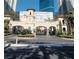 Close-up of an ornate gatehouse showcasing detailed architecture and manicured landscaping, creating a regal atmosphere at 2777 Paradise Rd # 2701, Las Vegas, NV 89109