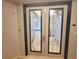 A close up of the double front door with decorative glass inserts at 2777 Paradise Rd # 2701, Las Vegas, NV 89109