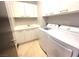 Well-equipped laundry room with modern washer, dryer, sink, and storage cabinets at 2777 Paradise Rd # 2701, Las Vegas, NV 89109