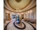 A lavish lobby featuring a striking chandelier, elegant marble flooring, and sophisticated decor at 2777 Paradise Rd # 2701, Las Vegas, NV 89109