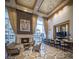Comfortable lounge featuring a stone fireplace, high ceilings, large windows, and stylish seating options at 2777 Paradise Rd # 2701, Las Vegas, NV 89109