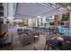 Inviting patio area with modern furniture, outdoor lighting, and a cozy fireplace overlooking a beautiful pool at 2777 Paradise Rd # 2701, Las Vegas, NV 89109