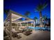 Stunning pool area with a fire pit, covered seating, and lush landscaping for ultimate relaxation and entertainment at 2777 Paradise Rd # 2701, Las Vegas, NV 89109