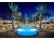 Beautiful, modern pool area surrounded by palm trees and covered seating offering a luxurious outdoor experience at 2777 Paradise Rd # 2701, Las Vegas, NV 89109