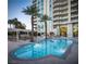 Stylish pool with palm trees and seating areas, set against a backdrop of sleek modern architecture, perfect for relaxation at 2777 Paradise Rd # 2701, Las Vegas, NV 89109