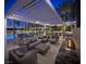 Beautiful outdoor space with a pool, fire pit, comfortable seating, and dining area for entertaining guests at 2777 Paradise Rd # 2701, Las Vegas, NV 89109