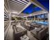 Relaxing pool area with a central fire pit, multiple seating areas, and covered pergolas for ultimate outdoor enjoyment at 2777 Paradise Rd # 2701, Las Vegas, NV 89109