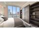 Bedroom with large windows offering city views, a built-in wardrobe, and a comfortable bed at 2777 Paradise Rd # 2701 Ph, Las Vegas, NV 89109