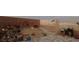 A backyard with a block wall and desert landscape features a beautiful view of the city at 2822 La Palma Dr, Laughlin, NV 89029