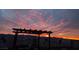 This photo features a vibrant sunset, a view, and a covered area at 2822 La Palma Dr, Laughlin, NV 89029