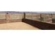 A backyard view with block wall and iron fence and a desert landscape at 2822 La Palma Dr, Laughlin, NV 89029