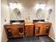 Bathroom boasts dual sinks, vanities, a central dresser, and modern fixtures at 2822 La Palma Dr, Laughlin, NV 89029
