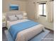 Comfortable bedroom featuring a queen-sized bed, soft blue accents, and ample natural light at 2822 La Palma Dr, Laughlin, NV 89029