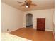 Spacious bedroom featuring ceiling fan, cork floors and archway to bathroom at 2822 La Palma Dr, Laughlin, NV 89029
