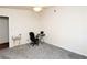 Simple bedroom with carpet, a ceiling fan and a small black desk and chair at 2822 La Palma Dr, Laughlin, NV 89029