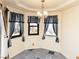Cozy breakfast nook with large windows, stylish curtains, and a charming chandelier at 2822 La Palma Dr, Laughlin, NV 89029