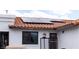 Charming exterior showcases solar panels on a red tile roof, enhancing energy efficiency at 2822 La Palma Dr, Laughlin, NV 89029