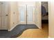 Hallway with contrasting flooring between rooms featuring French door to outside at 2822 La Palma Dr, Laughlin, NV 89029