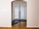 Inviting hallway with contrasting floors and view of the double doors at 2822 La Palma Dr, Laughlin, NV 89029