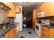 Modern kitchen featuring wooden cabinets, granite countertops, stainless steel appliances, and an open layout at 2822 La Palma Dr, Laughlin, NV 89029
