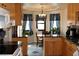 Well-lit kitchen featuring wood cabinets, black granite countertops, and an adjacent dining area at 2822 La Palma Dr, Laughlin, NV 89029