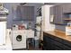 Functional laundry room equipped with a washer, dryer, and plenty of cabinet space at 2822 La Palma Dr, Laughlin, NV 89029