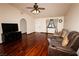 Inviting living room with sleek hardwood floors, comfortable seating, and a bright window with stylish curtains at 2822 La Palma Dr, Laughlin, NV 89029