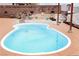 Inviting kidney-shaped pool with rock waterfall feature in a beautifully landscaped backyard oasis at 2822 La Palma Dr, Laughlin, NV 89029