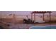 Outdoor patio with freeform pool, desert landscaping and covered patio at 2822 La Palma Dr, Laughlin, NV 89029