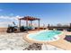 Backyard pool and pergola with beautiful stone and concrete border at 2822 La Palma Dr, Laughlin, NV 89029