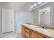 Bathroom with double sinks, granite countertop and glass enclosed shower at 285 Canyon Spirit Dr, Henderson, NV 89012