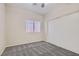 This bedroom has carpet floors, a window with blinds, and a sliding-door closet to maximize space at 285 Canyon Spirit Dr, Henderson, NV 89012