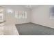 Bright dining area with gray carpet, tile floor and sliding glass doors to the backyard at 285 Canyon Spirit Dr, Henderson, NV 89012