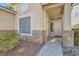 Inviting front entrance with brick accents and well-kept landscaping, creating a warm welcome at 285 Canyon Spirit Dr, Henderson, NV 89012