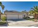 Well-maintained single-story home with three-car garage, mature landscaping, and desert-friendly design at 285 Canyon Spirit Dr, Henderson, NV 89012