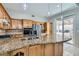 Updated kitchen with granite countertops, stainless steel appliances, and custom wood cabinetry at 285 Canyon Spirit Dr, Henderson, NV 89012