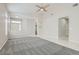 Spacious living room features neutral tones, plush carpeting, and tile flooring leading to front door at 285 Canyon Spirit Dr, Henderson, NV 89012