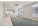 Bright living room with plush carpeting, vaulted ceilings, and large windows for abundant natural light at 285 Canyon Spirit Dr, Henderson, NV 89012