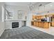 Spacious living room with fireplace and open access to the kitchen and dining areas at 285 Canyon Spirit Dr, Henderson, NV 89012