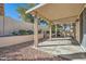 Covered patio area with concrete flooring, perfect for outdoor relaxation and a beautiful landscaped area at 285 Canyon Spirit Dr, Henderson, NV 89012