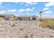 Backyard landscaping with desert rock at 2868 Foxtail Creek Ave, Henderson, NV 89052