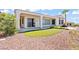 Exterior of home with a covered patio and desert landscaping at 2868 Foxtail Creek Ave, Henderson, NV 89052