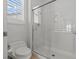 This bathroom features a modern glass shower and low-flow toilet at 2868 Foxtail Creek Ave, Henderson, NV 89052