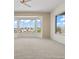 Sun-filled bedroom featuring large windows with neighborhood views at 2868 Foxtail Creek Ave, Henderson, NV 89052