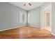 This bedroom features hardwood floors, neutral paint, and is adjacent to another room at 2868 Foxtail Creek Ave, Henderson, NV 89052